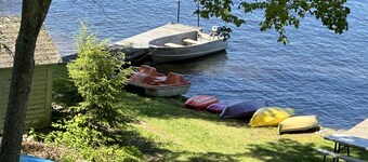 Charming lakeside cottage steps away from private sandy beach.
