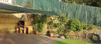 House with private pool, artificial grass, terraces and flat gardens.