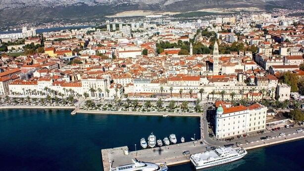 An aerial view of a coastal city with a marina, buildings, and mountains in the background. - Romantic Apartment Johnny I, hot tub in garden, Studio in Split center, Croatia  (Split)