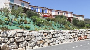 A stone wall with a paved road in front. - NEW VILLA LES CORALINES, WITH SEA VIEW AND SHARED POOL (Roquebrune-Sur-Argens)