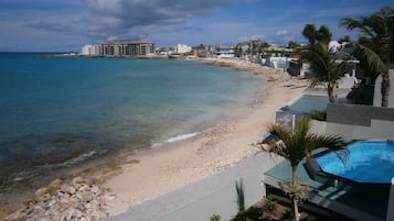 On the beach, sun loungers, beach towels