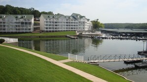A waterfront hotel with multiple balconies, a dock, and a marina. -  Parkview Bay 616, Book NOW for the SHOOTOUT RACE, VERY CLOSE TO RACE (Osage Beach)