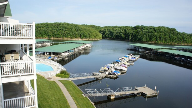 A waterfront property with a dock, a pool, and a building with multiple decks. -  Parkview Bay 616, Book NOW for the SHOOTOUT RACE, VERY CLOSE TO RACE (Osage Beach)