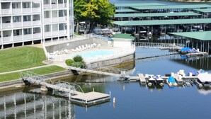 A waterfront hotel with a pool, dock, and boats. -  Parkview Bay 616, Book NOW for the SHOOTOUT RACE, VERY CLOSE TO RACE (Osage Beach)