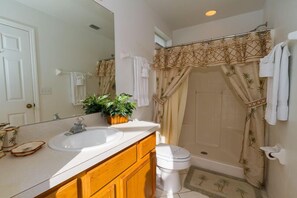 Combined shower/tub, hair dryer, towels, soap