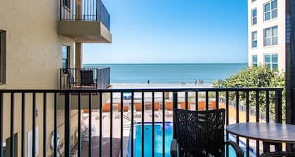 BEACH LOUNGES AND UMBRELLA SERVICE INCLUDED! POOL IS OPEN AND PAVERS COMPLETED!