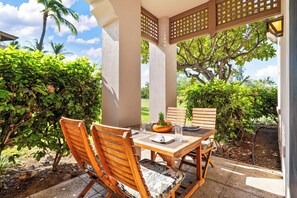 Step out to your private patio, where tropical breezes drift through lush gardens and a shaded dining area invites leisurely outdoor meals beneath swaying palms. - Includes beach gear! Waikoloa Colony Villas 1202 (Waikoloa Beach Resort)