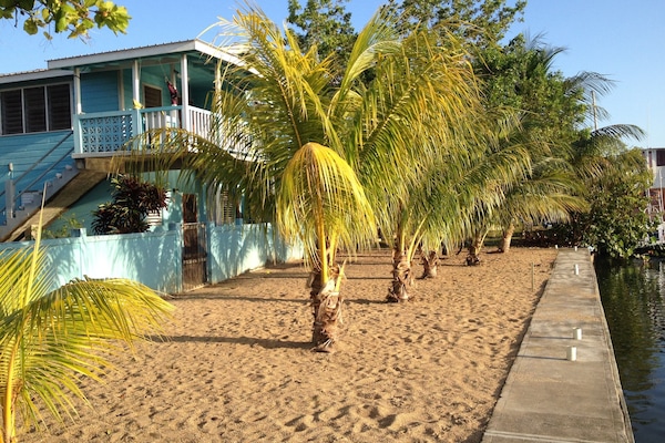 sandy sea wall along lagoon