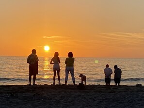 On the beach, sun-loungers, beach towels