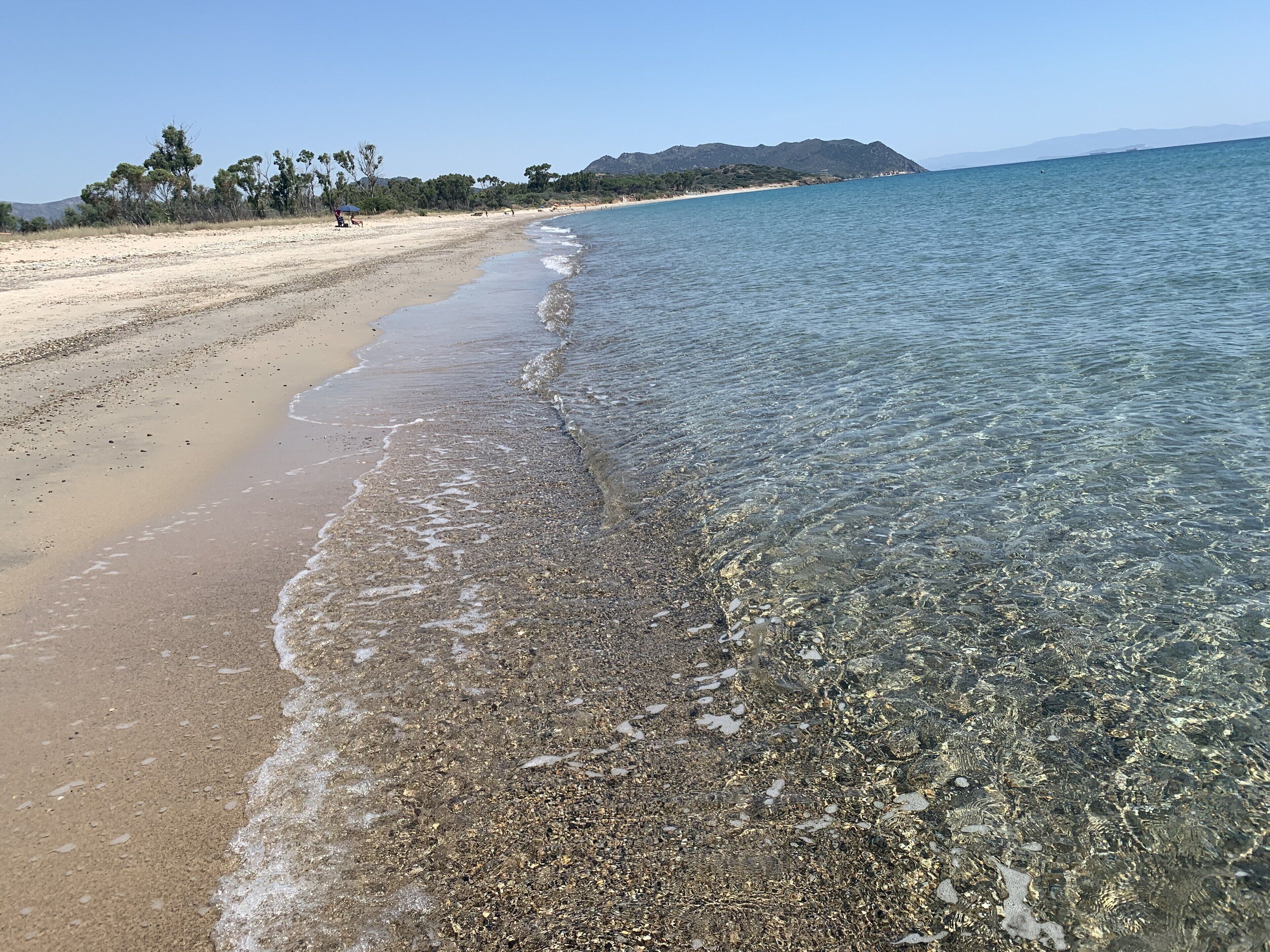 On the beach, sun-loungers