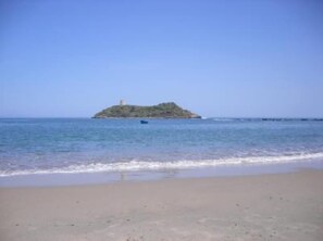 On the beach, sun-loungers