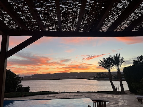 Large villa with heated pool directly on the lagoon beach with private jetty