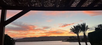 Large villa with heated pool directly on the lagoon beach with private jetty