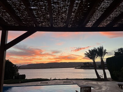 Large villa with heated pool directly on the lagoon beach with private jetty