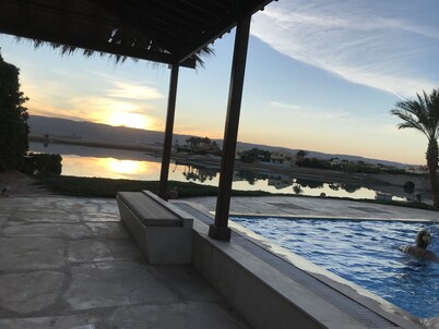 Large villa with heated pool directly on the lagoon beach with private jetty