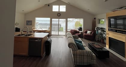 Private Gated Water Front Home on American Lake. Private beach and dock.