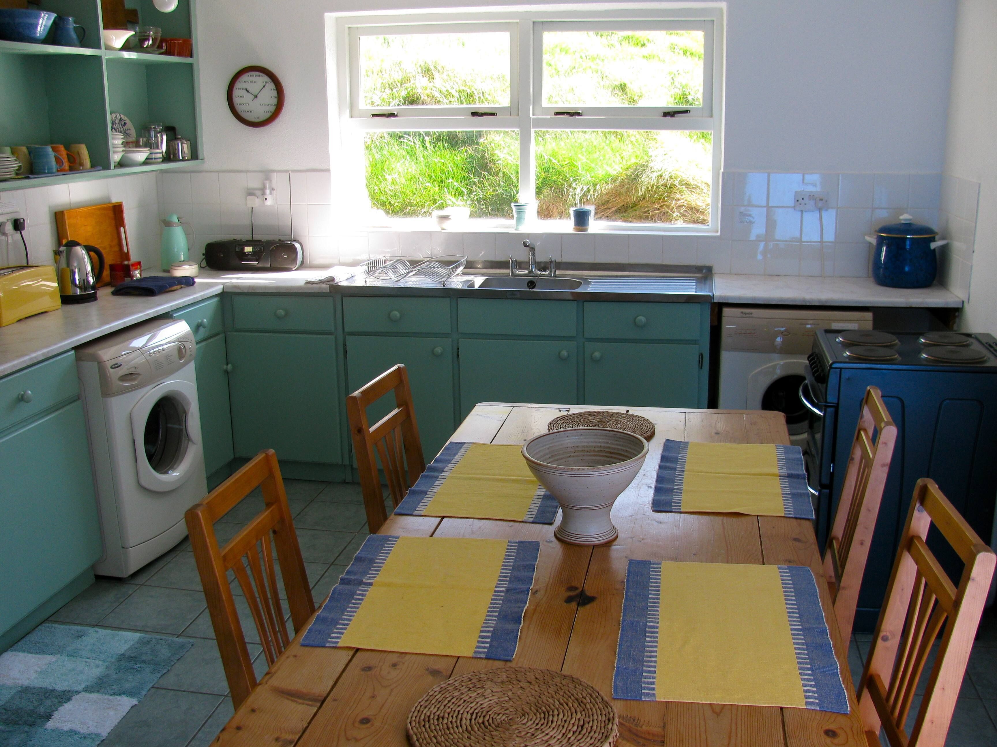 kitchen has washer and dryer and a dishwasher