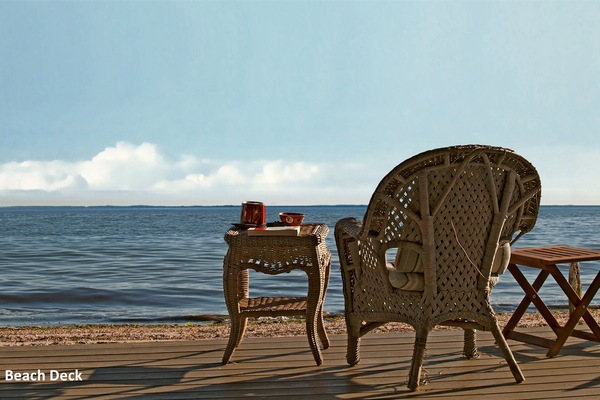 Relax on the wall-to-wall beach deck. Has both sunny and shaded, covered areas.