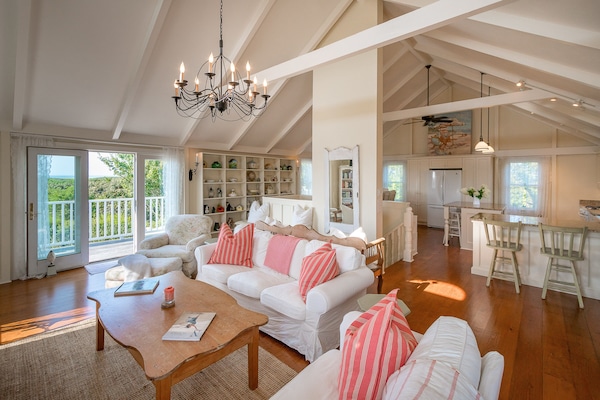 Living room, slipcovered sofas, airy,bright, with access to deck, fantastic view