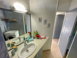 Shower, hair dryer, towels, toilet paper