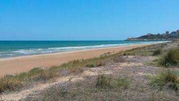 On the beach, sun loungers, beach towels