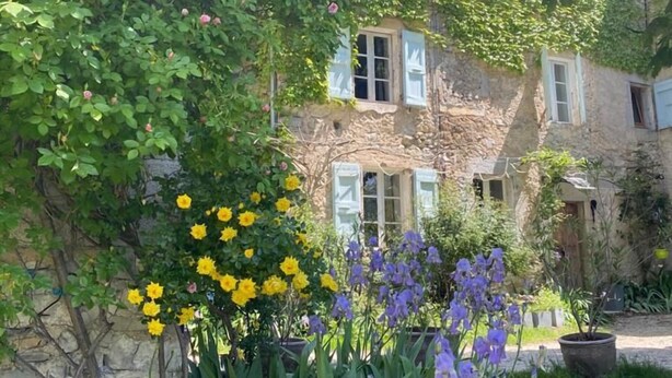 A stone house with white shutters, surrounded by lush greenery and flowering plants. - Into the wild: Charming house, surrounded by nature, large private pool. (Romeyer)