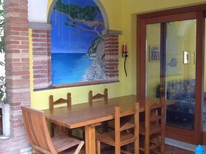 Dining - COMFORTABLE apartment with large veranda overlooking the pool. <br> (San Teodoro)