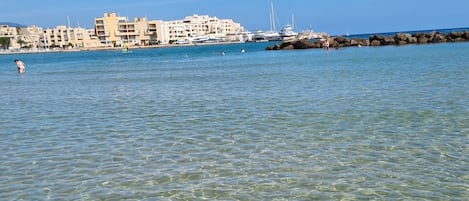 On the beach, sun-loungers