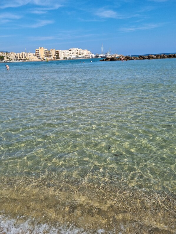 On the beach, sun-loungers