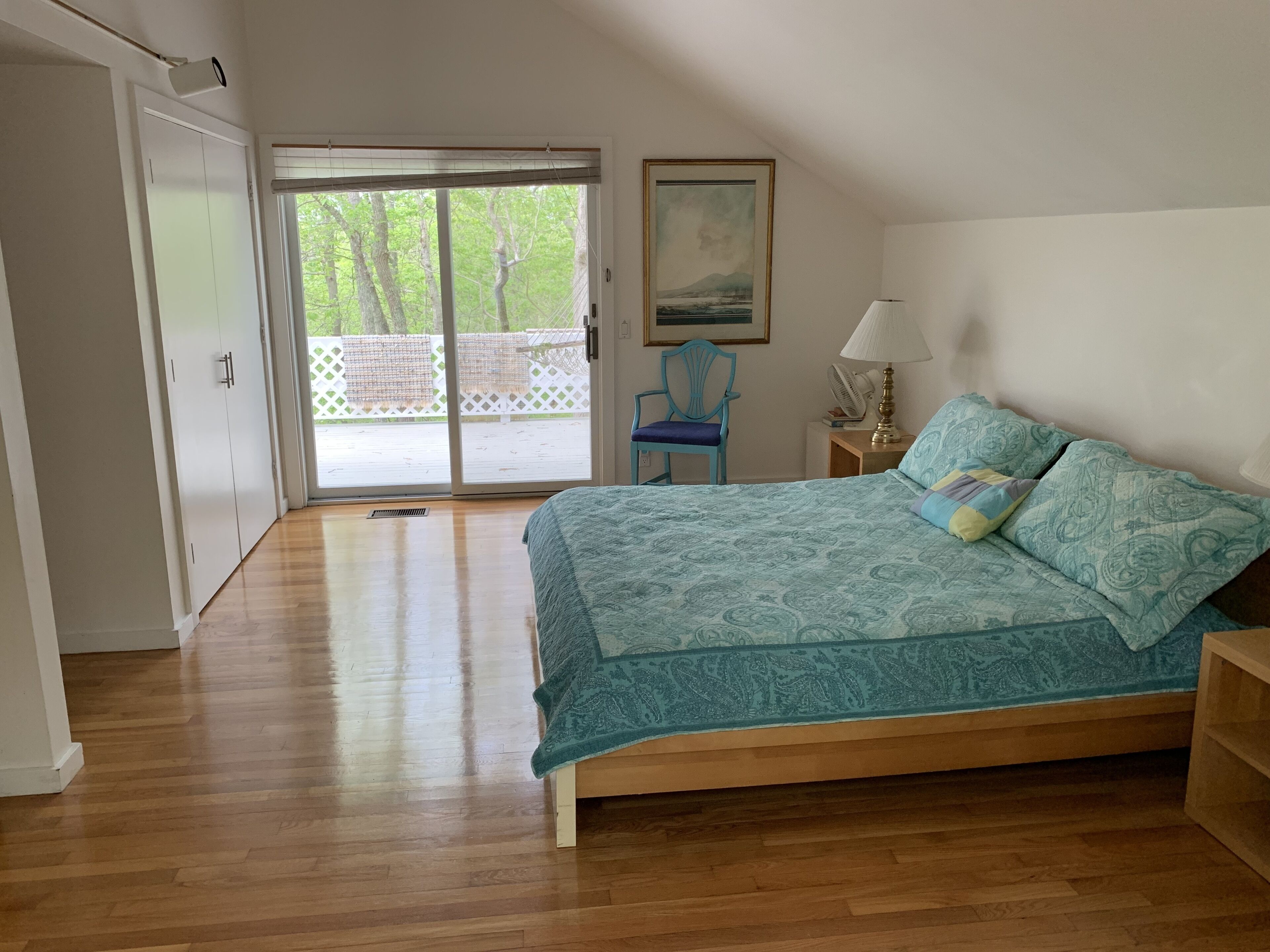 East wing bedroom with entrance to deck