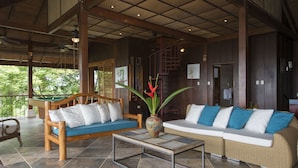 A spacious indoor area with a pool table, a sofa, and a coffee table. - Balinese Style Tropical Villa w/4 suites Huge Ocean Views Private Pool  (Manuel Antonio)
