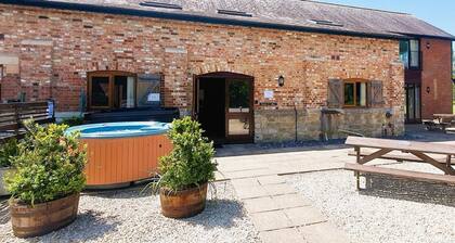 Luxury barn conversion sleeping 16 with hot tub and ensuite bedrooms