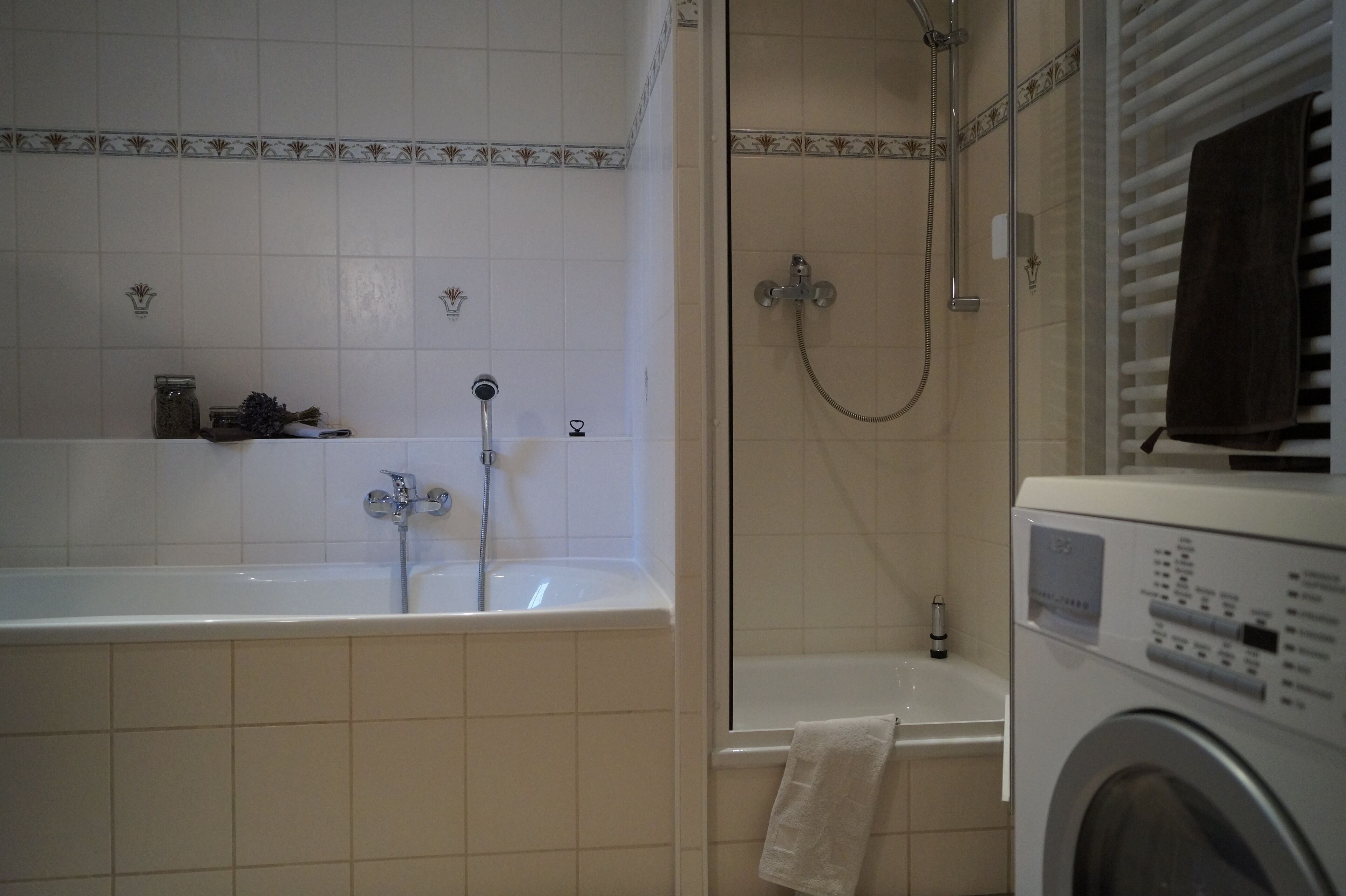 Bathtub, hair dryer, towels, soap