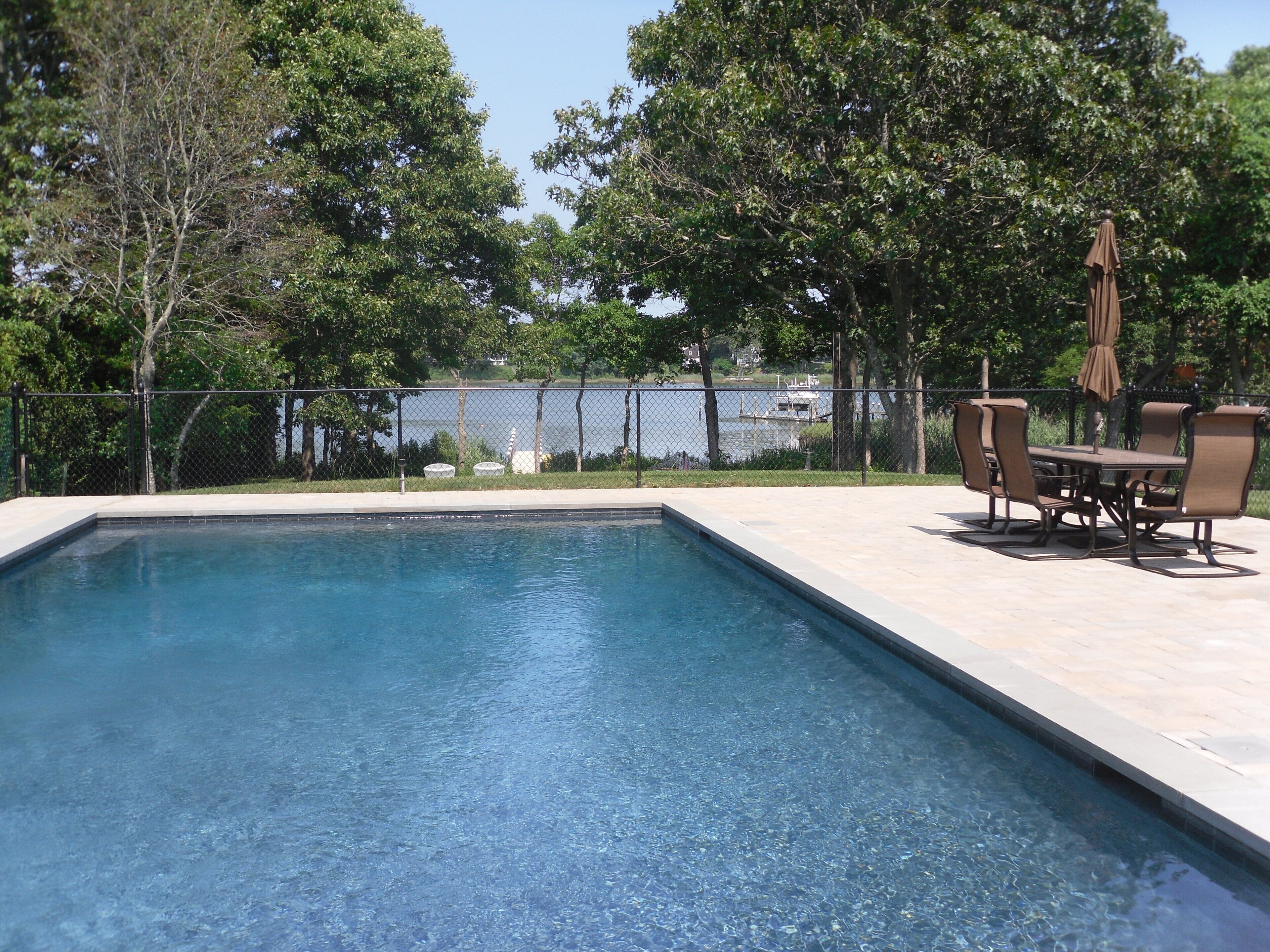 Lovely home by the sea with dock and heated Gunite pool!