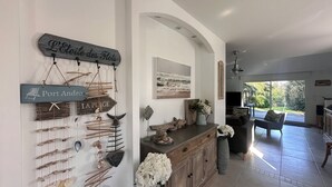 A coastal-themed interior with nautical decor, including wall-mounted signs and shells. - House / Villa - Le Palais (Bangor)