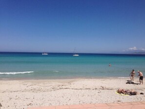 A beach with a clear sky, calm sea, and a boat in the distance. - Apartment/ flat - 20220 (L'île-Rousse)