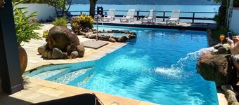 Luxury Beach house standing in front sand sea, pool and terrace 