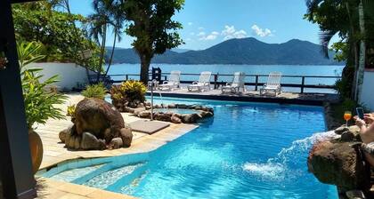 Luxury Beach house standing in front sand sea, pool and terrace