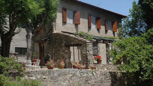 A rustic stone house with wooden shutters, a stone wall, and potted plants. - Ancient country house recently restored - beautiful private garden - panoramic (Pontassieve)