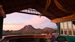 A covered outdoor seating area with a view of a mountain. - Vista Suite at El Encanto- Views, Privacy, Close to Beach (Cabo Pulmo)