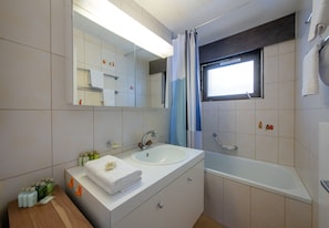 Bathtub, hair dryer, towels