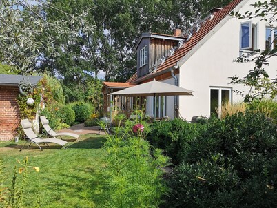 Cozy cottage in a fantastic location right on the river with a beautiful garden