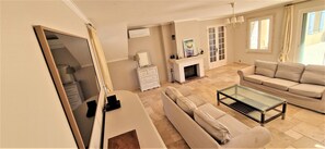 Flat-screen TV, video games, DVD player, books