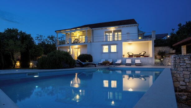 A two-story house with a swimming pool, outdoor seating, and a stone wall. - Villa Sun - charming villa, heated pool, full privacy, wedding, near Dubrovnik (Cavtat)