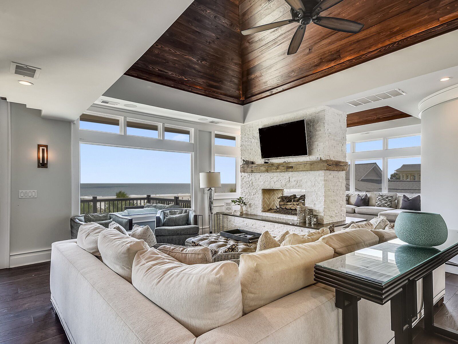 Flat-screen TV, fireplace, DVD player, smart speakers