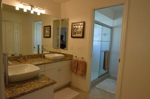 Combined shower/tub, hair dryer, towels, toilet paper