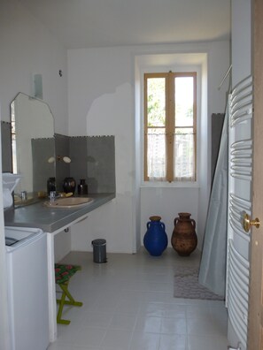 Combined shower/tub, hair dryer, towels, toilet paper