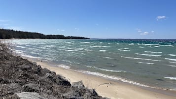 On the beach, sun loungers, beach towels