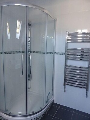 Bathtub, hair dryer, towels, soap