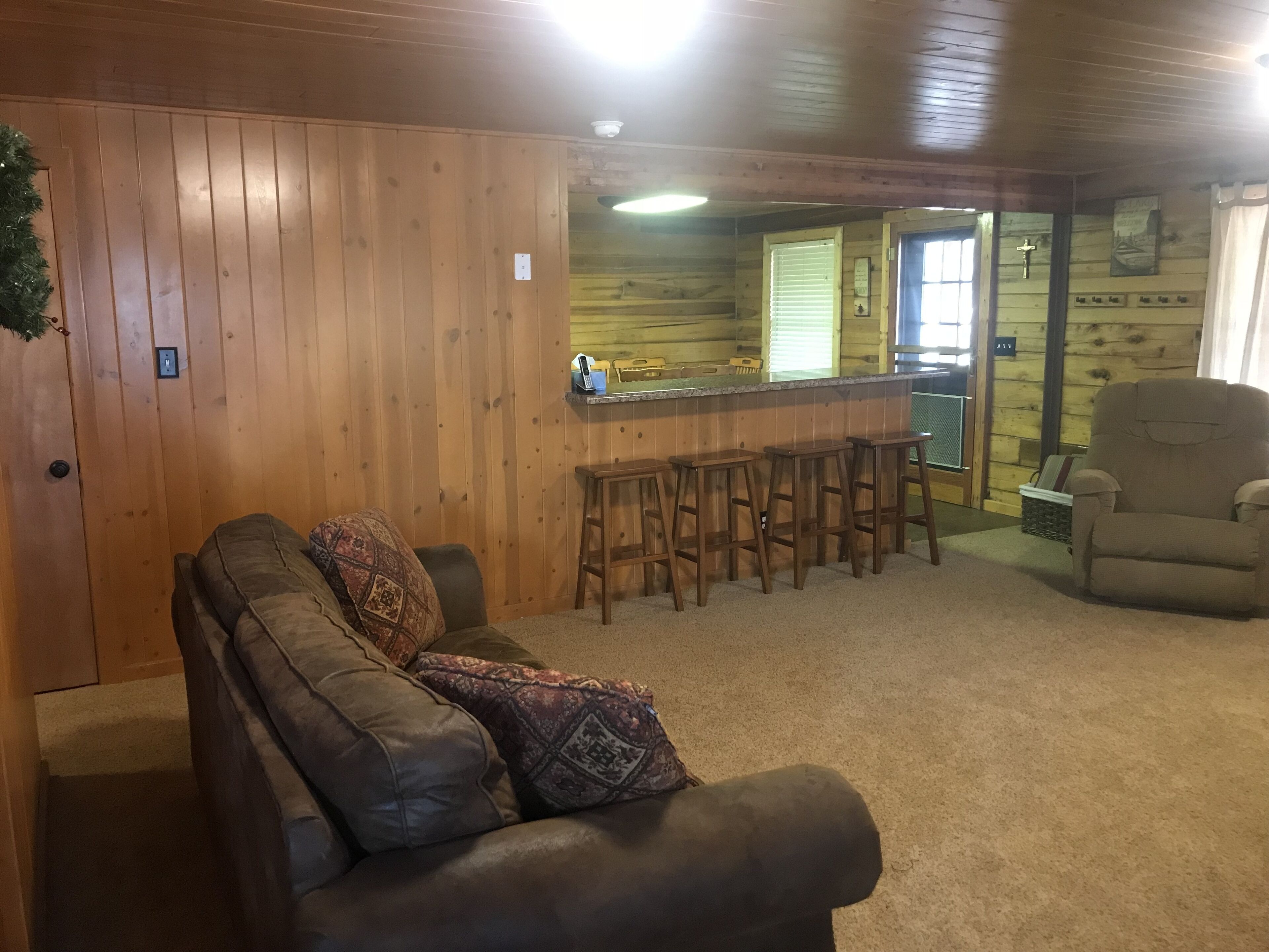 Family Friendly Lakefront Cedar Log Cabin on 2 acres at Rainbow Lake.